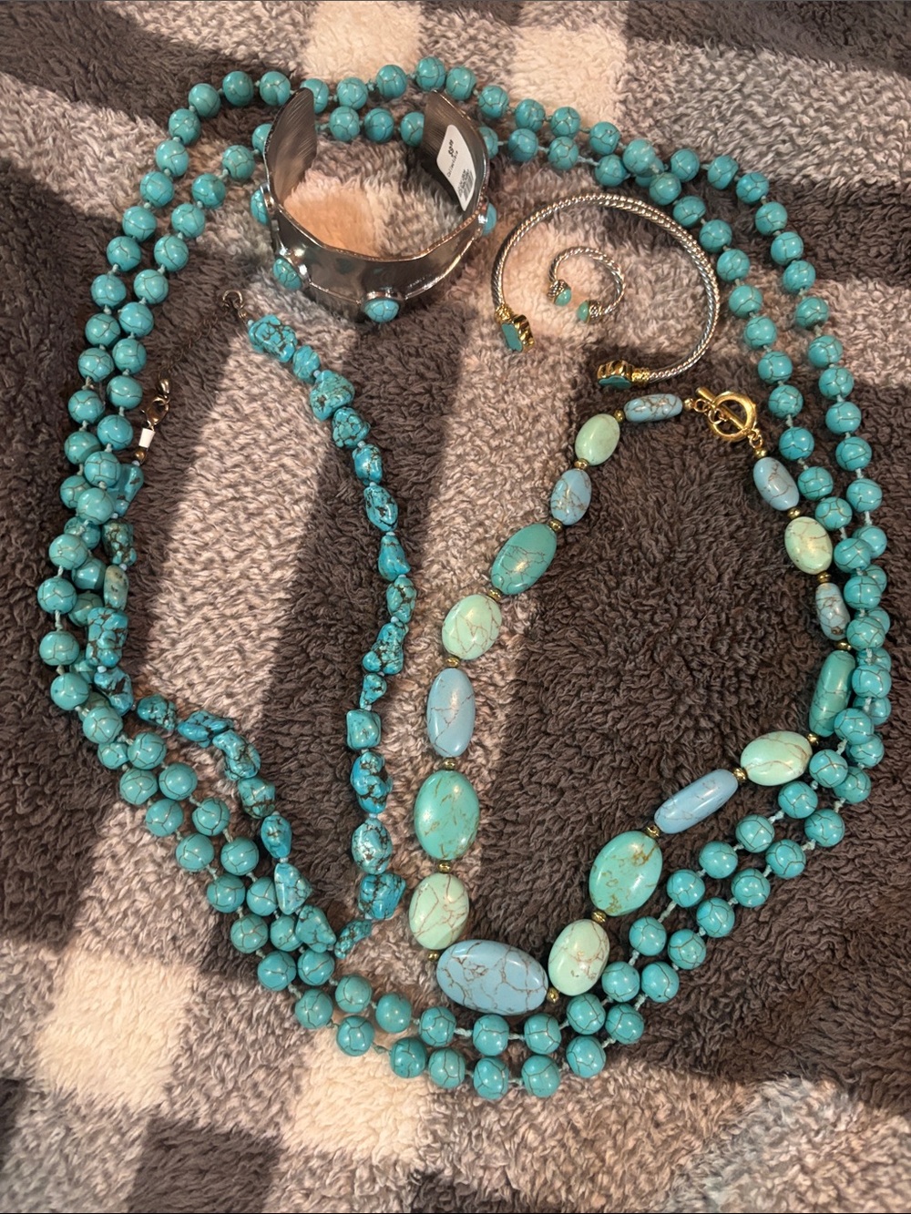 three turquoise necklaces, two bangles and one ring